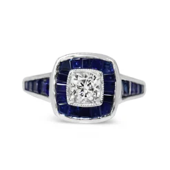 18ct White Gold Cushion Cut Diamond and Channel Set Sapphire Halo Ring