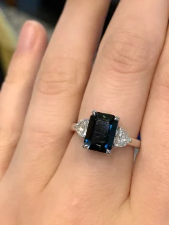 18ct White Gold Emerald Cut Sapphire and Diamond Heart 3 Stone Ring