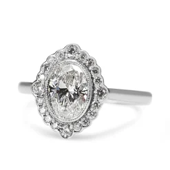 18ct White Gold Oval Diamond Daisy Style Halo Ring