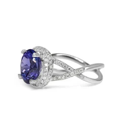 18ct White Gold Tanzanite and Diamond Halo and Twist Ring