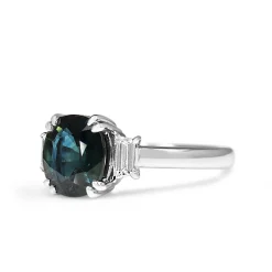 18ct White Gold Teal Sapphire and Step Cut Trapezoid Diamond 3 Stone Ring