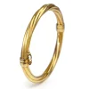 18ct Yellow Gold Twisted Oval Hinged Bangle